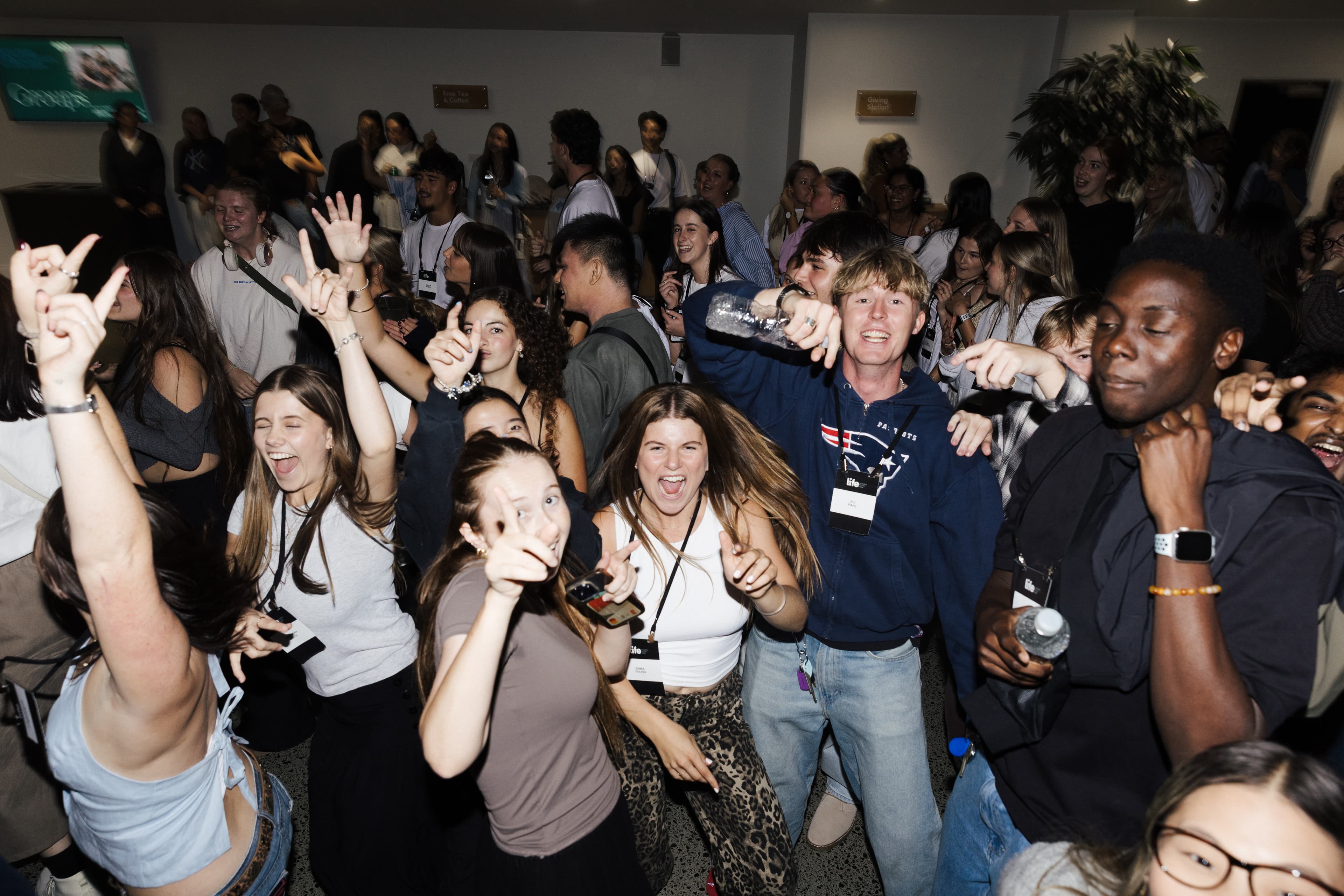 Young adults dancing and smiling at the dance party at The YA Gathering